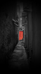 A red door at the end of the alley