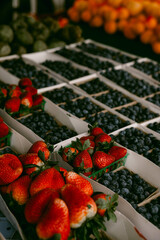Strawberries and blueberries for sale at farmer's market