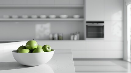 An all-white kitchen with modern appliances, a single bowl of green apples on the counter