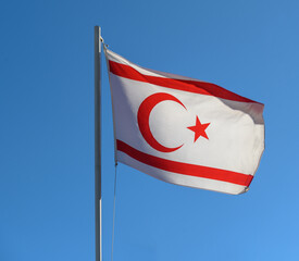 National flag of Turkish Republic of Northern Cyprus on a flagpole