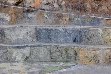 Sandstone quarry layers with roads. Digging industry texture background, Czech landscape