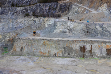 Sandstone quarry with excavator equipment. Digging industry background, Czech landscape