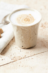 Coffee with milk on bright stone background. Close up.	