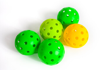 Multi colors pickleball balls isolated on a white background