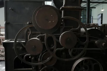 Fototapeten Verlassene Gebäude Old machinery in an abandoned clothes factory  © Laiotz