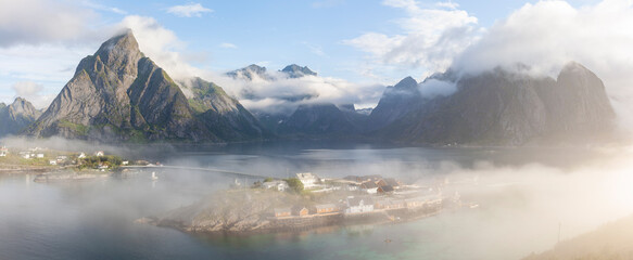 The village of Sakrisøya in Lofoten Islands on a beautiful foggy summer morning, Norway