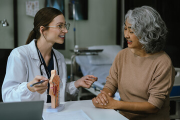 Female doctor explaining to patient results of model the process of patients. Diagnosis of diseases for Model Internal organ.