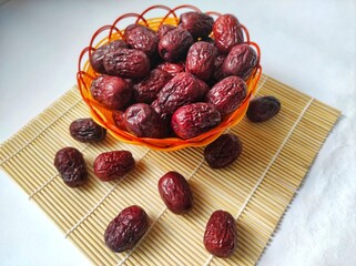 Dried grand jujube red dates, isolated on background.