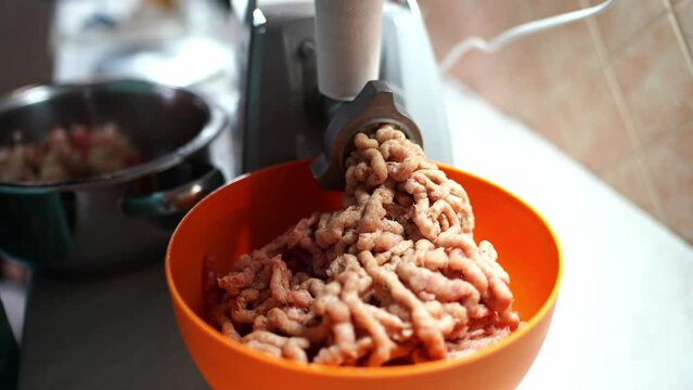 Electric meat grinder quickly grinds meat into minced meat. High quality 4k footage