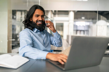 Millennial indian man business consultant have phone call with client