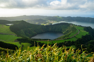 Fototapeta premium View from Miradouro da Boca do Inferno to Sete Citades, Azores, Portugal during sunset or sunrise 