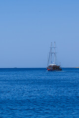 Sailing lboat at open sea in sunshine