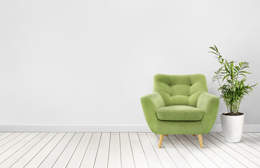 Empty living room wall mockup with green velvet armchair, and palm plant in pot - 760489628