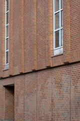 brick wall with window and door of a large building