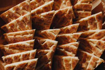 Beautifully decorated catering banquet table with different food snacks and appetizers with sandwich, caviar, fresh fruits on corporate christmas birthday party event or wedding celebration.