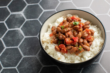 Vegan bean curry with rice and tomatoes. Indian cuisine. Vegetarian dish. 
