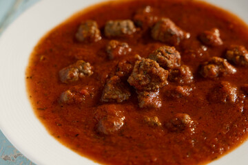 Close up of meatballs with tomato sauce 