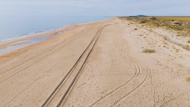 tire tracks on the beach - Lido de Thau - Sète, France