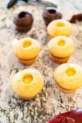 Filling Vanilla, Chocolate Cupcakes with Lemon, Raspberry