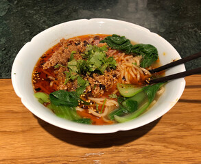 Gourmet ramen style soup with spicy pork and leek