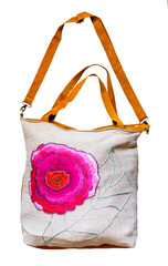 handcrafted canvas bag with embroidered flower cutout on white background