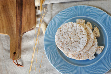 Top view of Jasmin Rice Cracker on Blue Plate