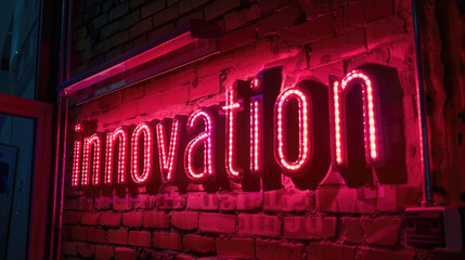 A neon sign spelling out innovation casts a pink glow against the dark bricks of a wall, suggesting creativity and advancement