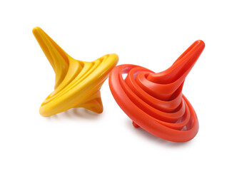 Two colorful spinning tops on white background