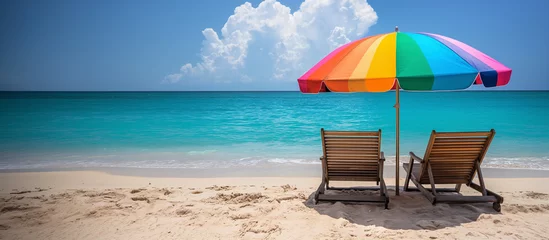 Foto op Canvas Sillas y sombrilla  en una playa vacía en verano © VicPhoto