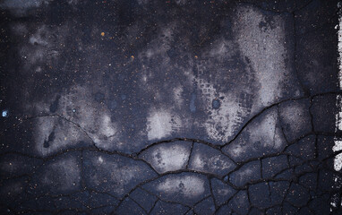 Dramatic cracks on street asphalt texture background