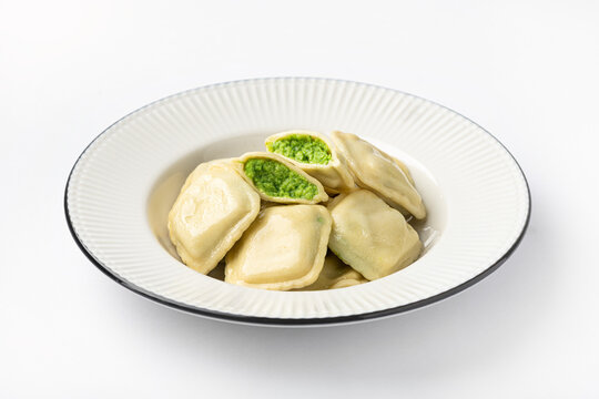 Ravioli with ricotta and spinach on a white background, selective focus