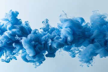 A blue substance is floating in the air with a white background and a white background behind it is