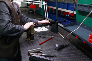 Processing line of assembling assault rifle.