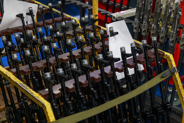 Modern assault rifles at storehouse of big military plant.