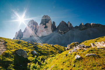 Famous rocky massif Tre Cime di Lavaredo (Drei Zinnen). Italian Alps, Sexten Dolomites, South Tyrol, Europe. - obrazy, fototapety, plakaty
