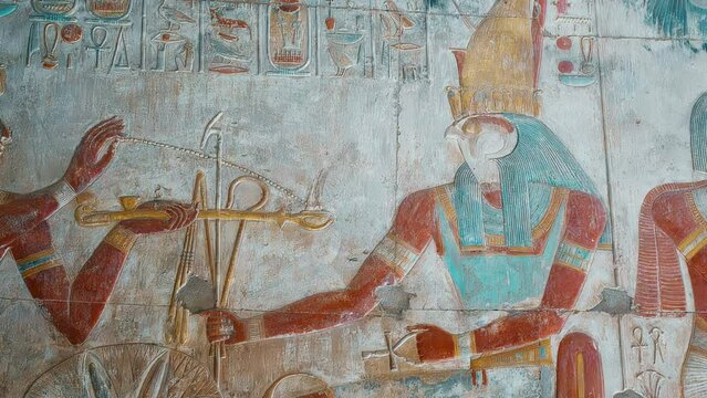 Ancient Egyptian hieroglyphs and bas-reliefs close-up in Temple of Seti I in Abydos, Egypt. Temple of Seti I contains the Abydos of Egypt King List from Menes until Seti I's father, Ramesses I