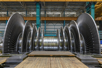Steam turbine rotor in a factory workshop.