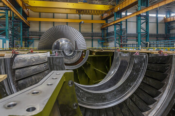 Assembly of a steam turbine rotor in a plant workshop. - obrazy, fototapety, plakaty