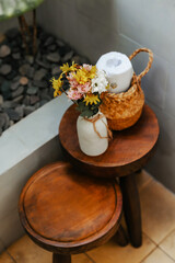 Minimalist decor on a small chair in the bathroom