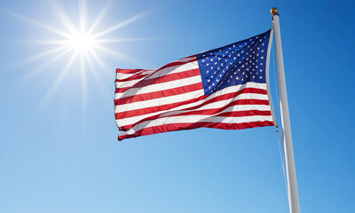 Fototapeta premium American flag against blue sky with sunset 