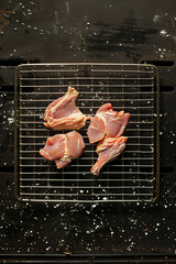 Top view of raw chicken on grilling rack for food background with copy space for text. Generative AI.