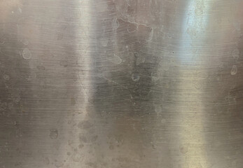 metal surface with scratches and smudges
