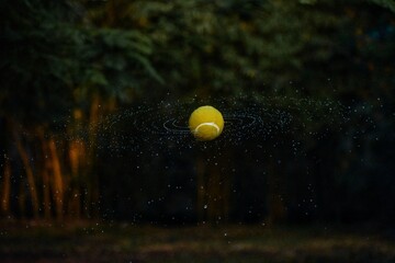 tennis ball in the net and water spreads like galaxy 
