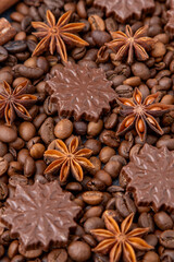 Food background. Coffee beans, anise stars and chocolate candies.