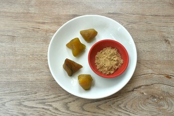 sweet Zongzi sticky rice steam with alkaline water dipping brown sugar crane on plate