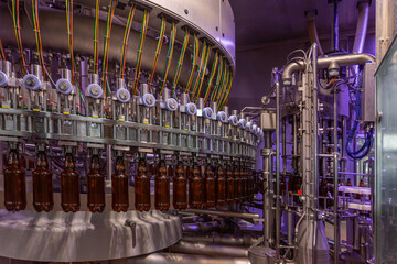 Closeup view of modern beer bottling line.