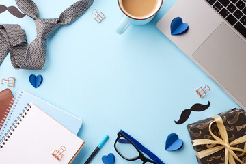 Father's day celebration setup: top view image of gift, notebook, and men's fashion accessories on a vibrant blue background with ample space for personal messages