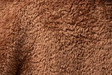 Texture of a brown faux fur as a background.