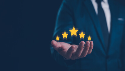 A businessman presenting a five-star rating, glowing stars, symbolizing high-quality service and...