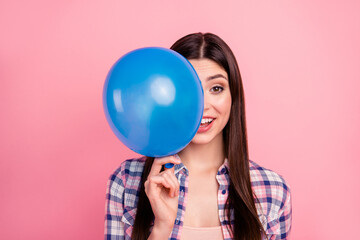 Close-up portrait of nice-looking attractive cute charming lovely girlish cheerful funny straight-haired lady wearing checked shirt holding in hand air ball congrats isolated over pink background